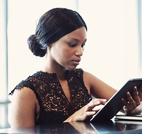 black office woman using ipad, Salitas Technological Solutions Top-Rated Website and Software Design Company in Nigeria